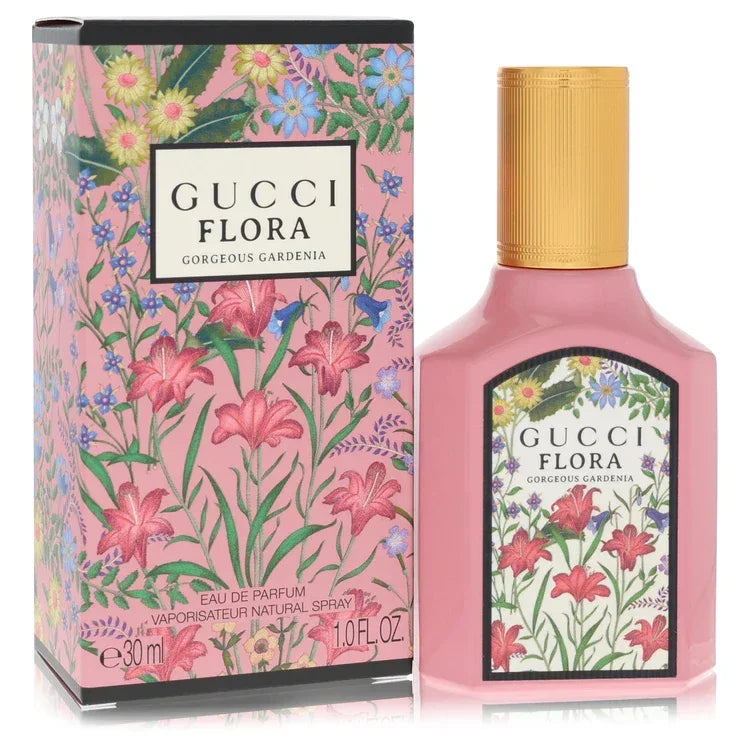 An authentic elegant pink bottle of Gucci Flora Gorgeous Gardenia Perfume featuring its iconic vintage floral pattern print presentation.