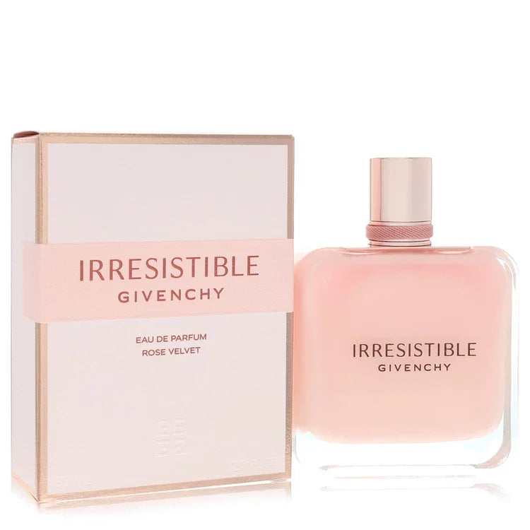 Irresistible Givenchy Rose Velvet Perfume signature luxury weighted clear glass flacon finished in a soft powdered pink sensory coating, displaying precise white typographical branding details and an elegant metallic capping architecture detail against a solid backdrop