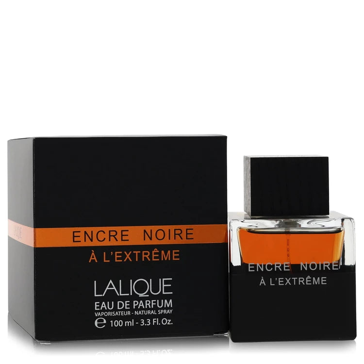 An authentic heavy glass bottle of Lalique Encre Noire A L'Extreme Cologne showcasing its dark wooden cap and minimalist black block design.