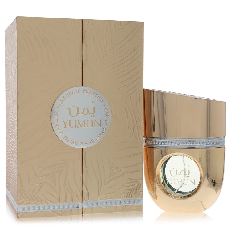 Arabiyat Prestige Yumun Perfume bottle in reflective gold finish with circular front detail