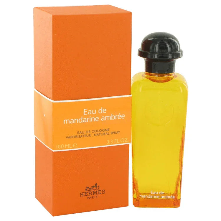 Hermes Eau De Mandarine Ambree Cologne signature luxury minimalist amber-tinted glass flacon displaying its premium fluid contents, precise labeling boundaries, and elegant capping details against a clean backdrop