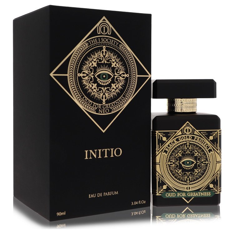 Black and gold perfume bottle and packaging with intricate designs on a white background