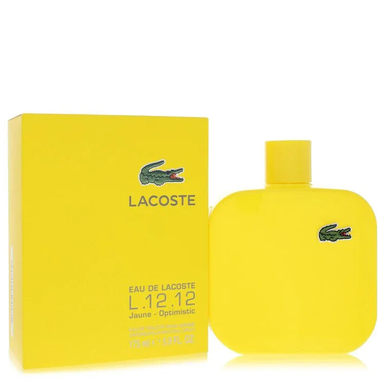Yellow Lacoste perfume bottle and packaging on a white background