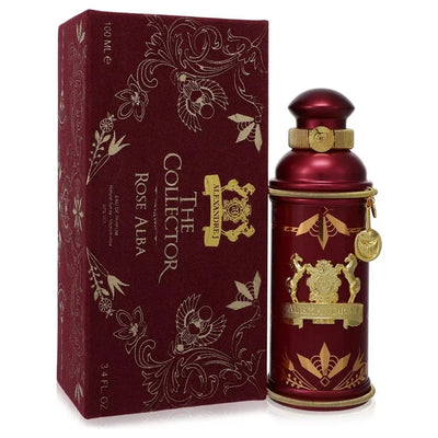 Red and gold perfume bottle with decorative packaging on a white background