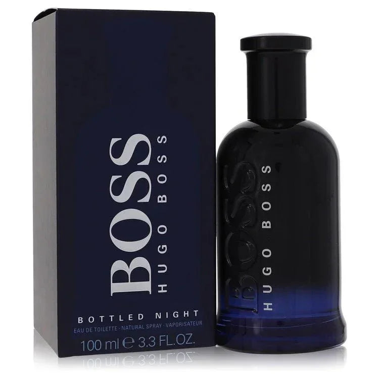 Hugo Boss Boss Bottled Night Eau de Toilette signature luxury midnight blue architectural glass flacon displaying its dark translucent fluid boundaries, styled with minimalist brand typographic text, and topped with a sleek deep black cap configuration detail against a solid backdrop