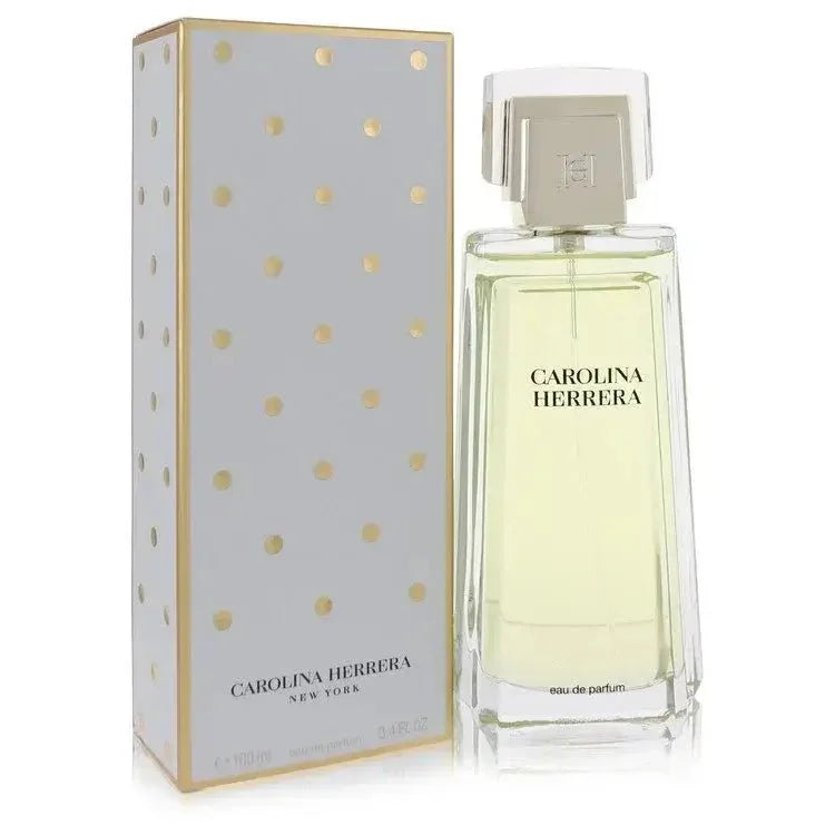 Carolina Herrera Eau de Parfum spray bottle with gold polka dot box, luxury fragrance