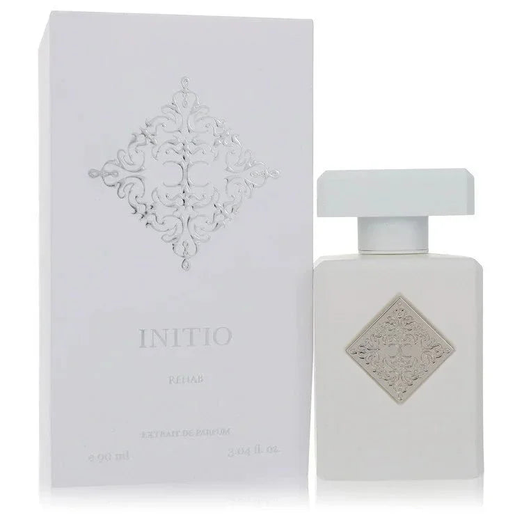 Initio Rehab perfume bottle and box, elegant white packaging with embossed design