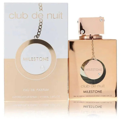 Club de Nuit Milestone Eau de Parfum gold perfume bottle and box with round accents