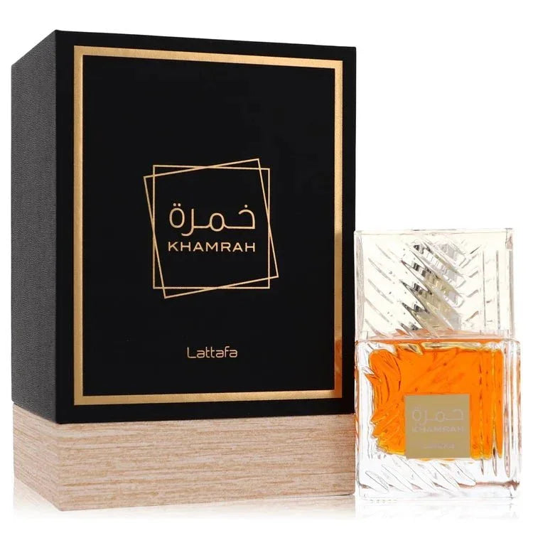 Lattafa Khamrah perfume bottle and black gold box with elegant wood base