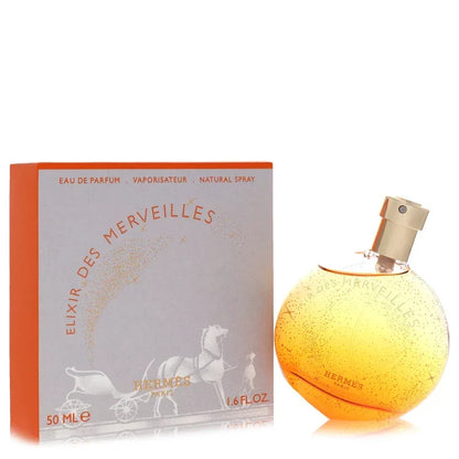 Hermes Elixir Des Merveilles Eau de Parfum round orange glass bottle, an enchanting and sophisticated woody oriental luxury fragrance.