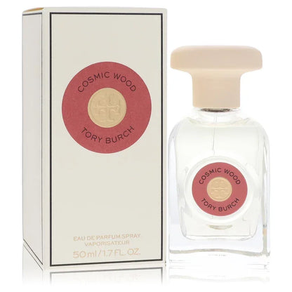 Tory Burch Cosmic Wood Perfume signature luxury modern clear architectural glass flacon showcasing its transparent fluid boundaries, styled with elegant typographic brand layout markings, and topped with an exquisite sculpted capping design detail against a solid backdrop