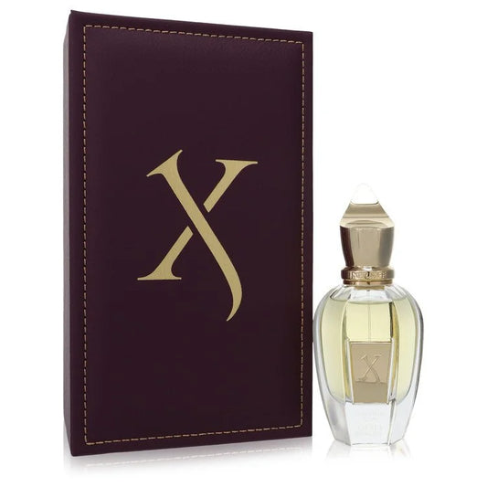 Perfume bottle with a matching purple case featuring a gold 'X' on a white background