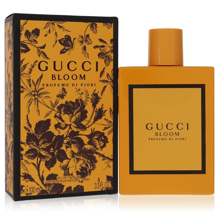 Gucci Bloom perfume bottle and packaging with floral design on a white background