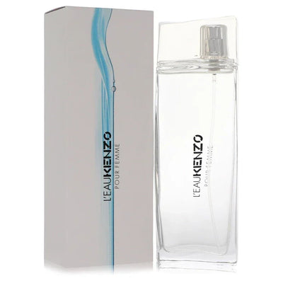L'eau Kenzo Perfume Pour Femme signature luxury clear glass flacon with elegant fluid wave contours mimicking moving water architecture, displaying precise typographic labels, and paired with a clear crystalline capping architecture detail against a solid backdrop