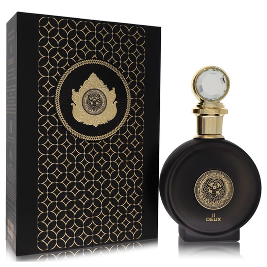 Black perfume bottle with gold accents and decorative packaging on a white background
