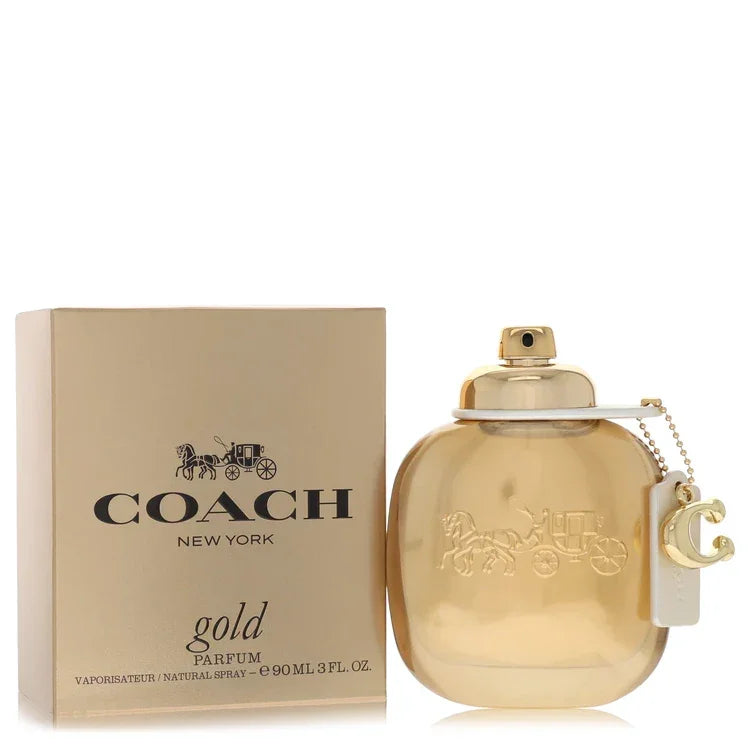 Coach New York gold parfum bottle and packaging on a white background