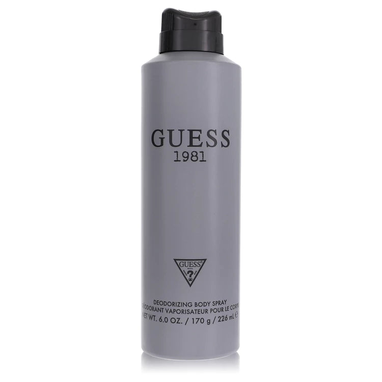 Gray body spray bottle with black cap and 'Guess 1981' branding on a white background