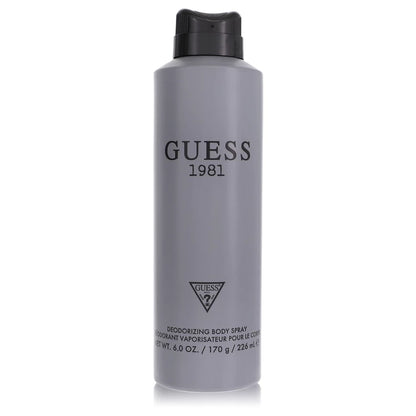 Gray body spray bottle with black cap and 'Guess 1981' branding on a white background