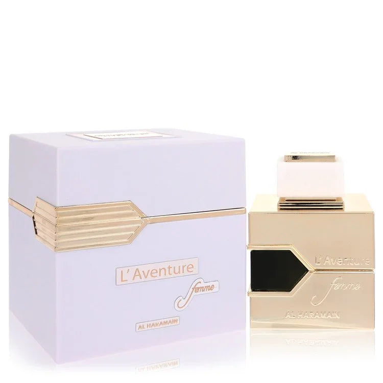 Gold and white perfume bottle with 'L'Aventure' packaging on a white background