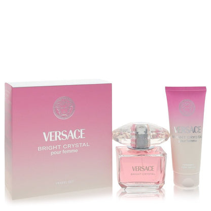 Versace Bright Crystal pour Femme travel set featuring a pink gradient box, a clear glass perfume bottle with pink liquid, and a matching pink-to-clear tube, on a white background.