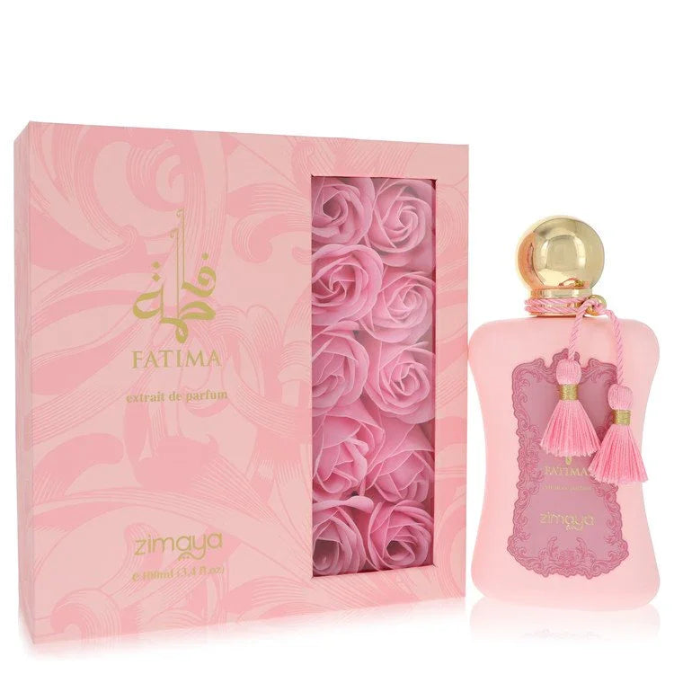 Pink perfume bottle with gold cap and tassel next to a pink box with rose design, featuring the brand 'Fatima'.