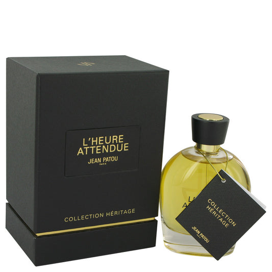 Perfume bottle and packaging of L'Heure Attendue by Jean Patou on a white background