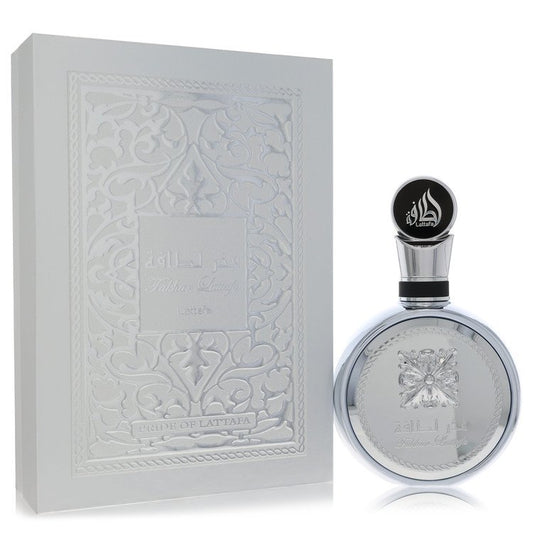 Lattafa Fakhar Platin luxury signature heavy silver metallic flacon displaying its intricate relief design and geometric capping structure against a clean display backdrop