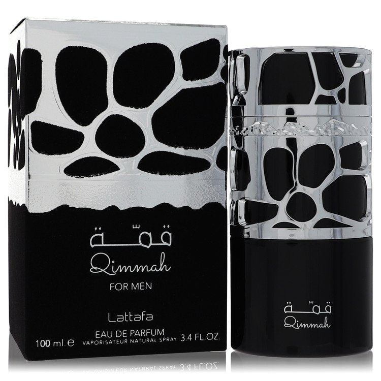 Lattafa Qimmah Cologne bottle in dark glass with metallic cage — woody spicy fragrance with bergamot, spices, woody notes, and leather.