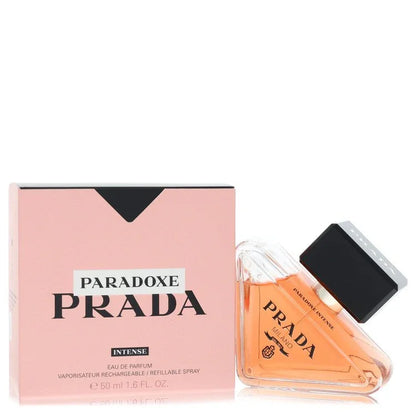 An authentic triangular glass bottle of Prada Paradoxe Intense Perfume showcasing its deep pink fragrance liquid and bold black cap.