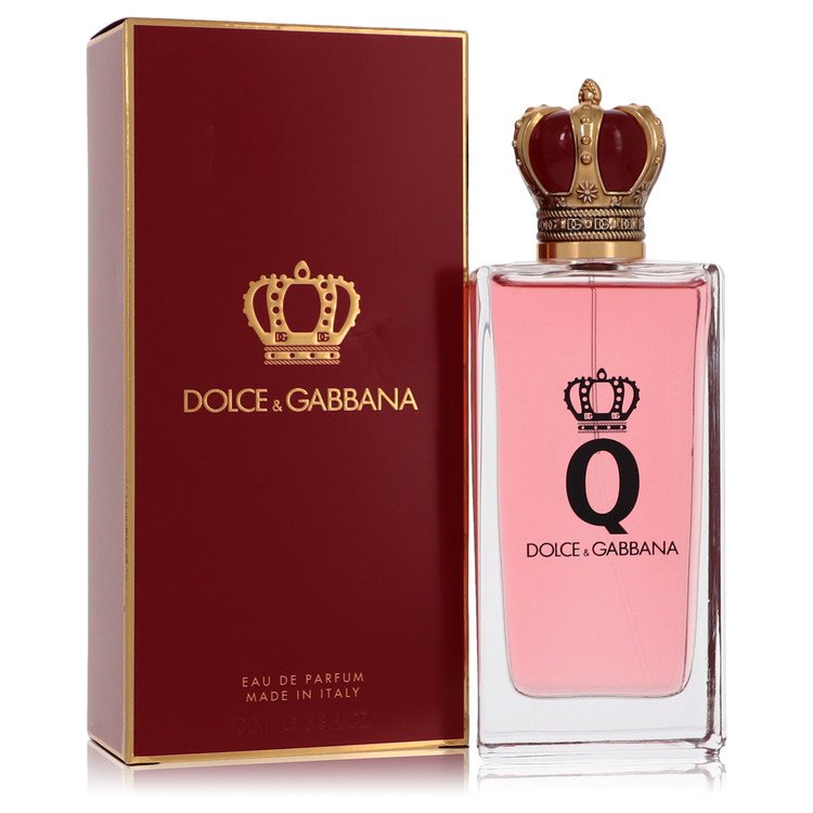 Dolce & Gabbana perfume bottle with pink liquid and gold crown on a white background