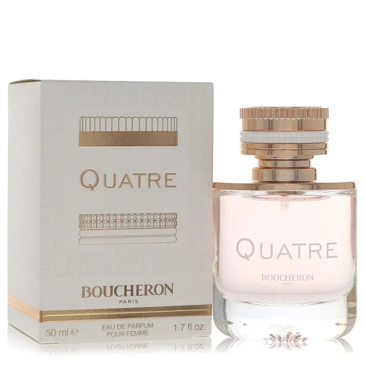 Boucheron Quatre Eau de Parfum bottle in luxury clear glass capped with iconic Quatre ring design — floral oriental fragrance with pear and rose.