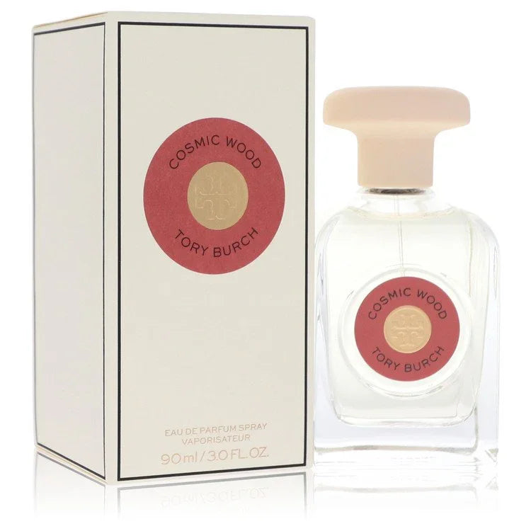 Tory Burch Cosmic Wood Perfume signature luxury modern clear architectural glass flacon showcasing its transparent fluid boundaries, styled with elegant typographic brand layout markings, and topped with an exquisite sculpted capping design detail against a solid backdrop