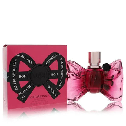 Viktor & Rolf Bonbon Perfume signature luxury wrapped bon bon bow-shaped pretty pink glass flacon displaying its premium fluid contours, precise typographical details, and sleek silver topper architecture details against a clean background
