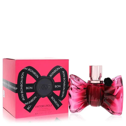 Viktor & Rolf Bonbon Perfume signature luxury wrapped bon bon bow-shaped pretty pink glass flacon displaying its premium fluid contours, precise typographical details, and sleek silver topper architecture details against a clean background