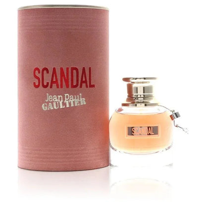 Scandal perfume bottle and pink cylindrical box with metallic cap and bold logo