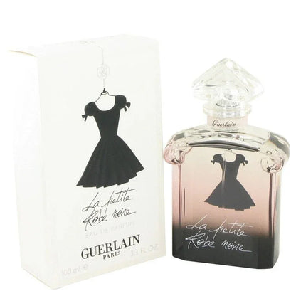 Guerlain perfume bottle and packaging with a dress silhouette on a white background