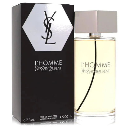 An authentic glass bottle of YSL L'Homme cologne by Yves Saint Laurent featuring its signature clear hexagonal cap and elegant golden liquid.
