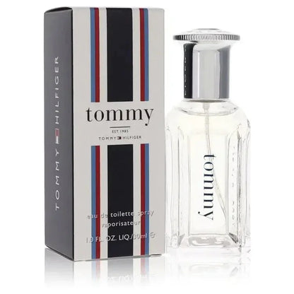 Tommy Hilfiger Cologne by Tommy Hilfiger signature clear glass bottle highlighting the crisp, energizing cologne liquid inside, displayed on a clean modern surface