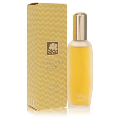 Aromatics Elixir perfume bottle with matching yellow textured box, floral design visible.