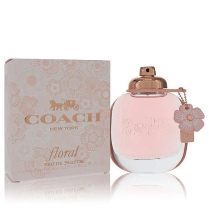 Coach Floral Eau de Parfum spray for women with pink flower box and bottle.